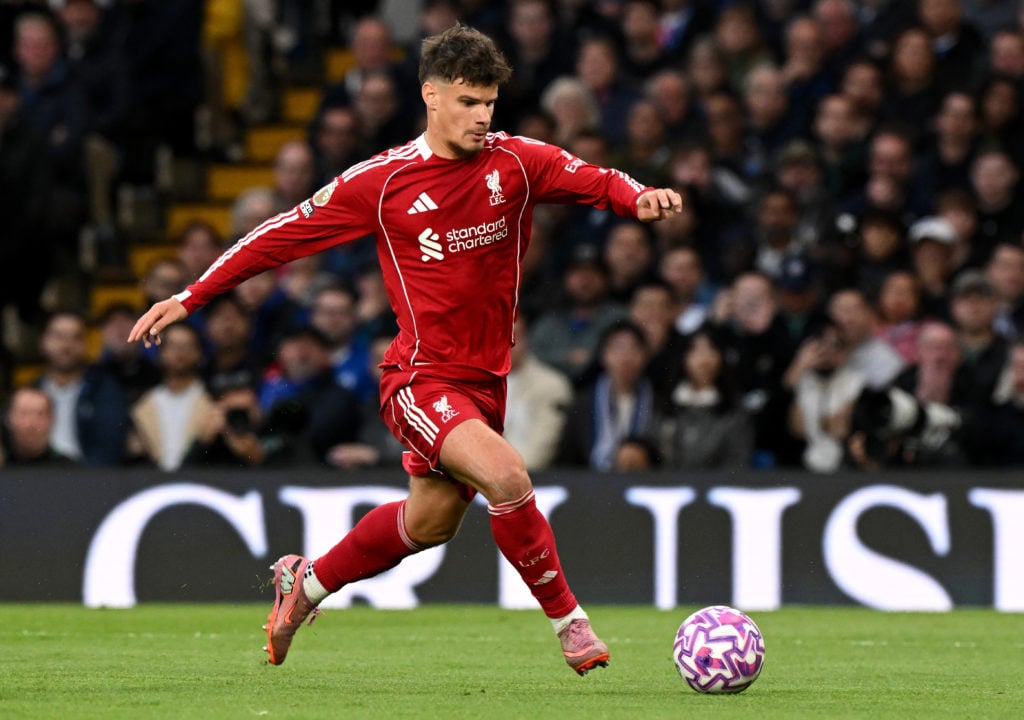 Milos Kerkez runs with the ball during Chelsea vs Liverpool