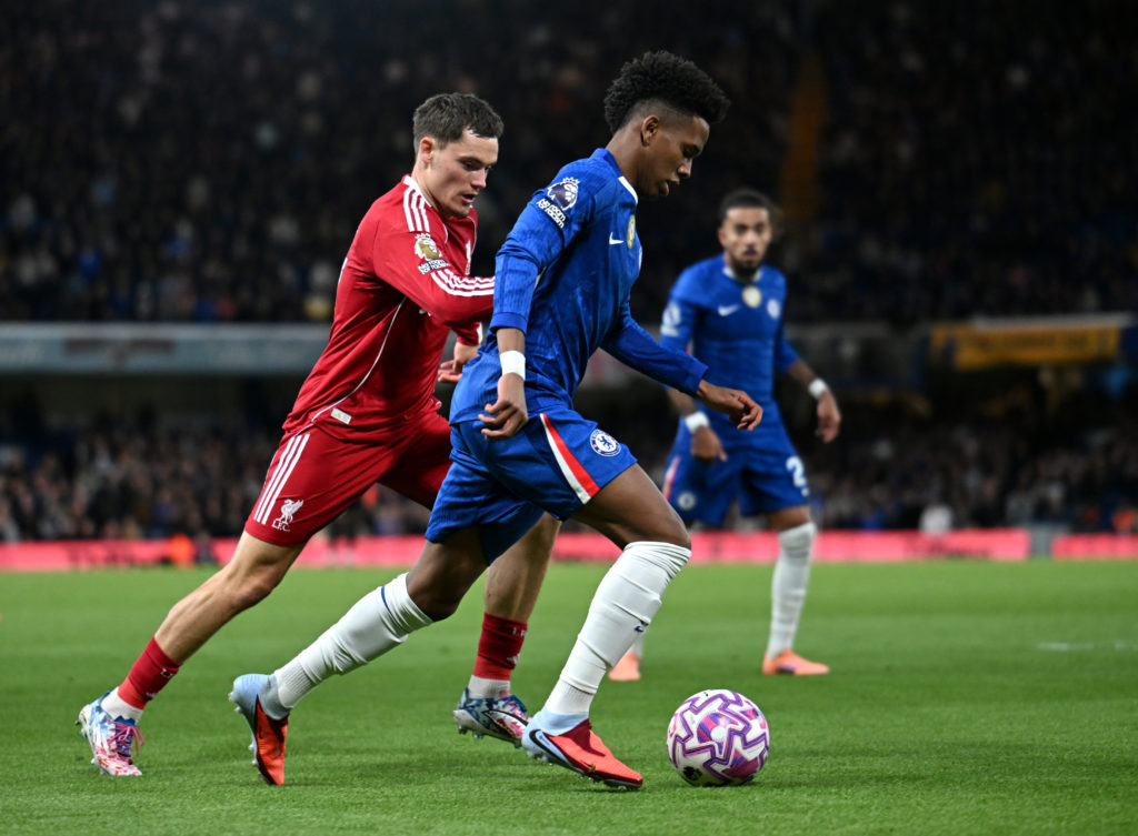Estevao of Chelsea runs with the ball whilst under pressure from Florian Wirtz of Liverpool during the Premier League match between Chelsea and Liverpool at Stamford Bridge.