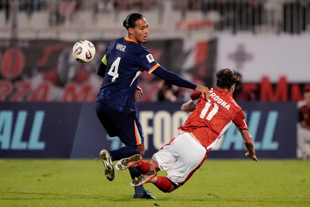 Virgil van Dijk of Holland, Irvin Cardona of Malta during the World Cup Qualifier match between Malta v Holland at the National Stadium.