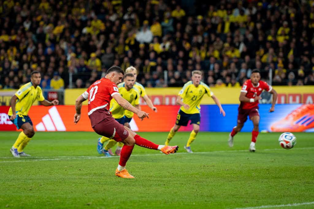 Granit Xhaka of Switzerland shots a goal from penalty during the FIFA World Cup 2026 qualifier match between Sweden and Switzerland at Strawberry Arena.