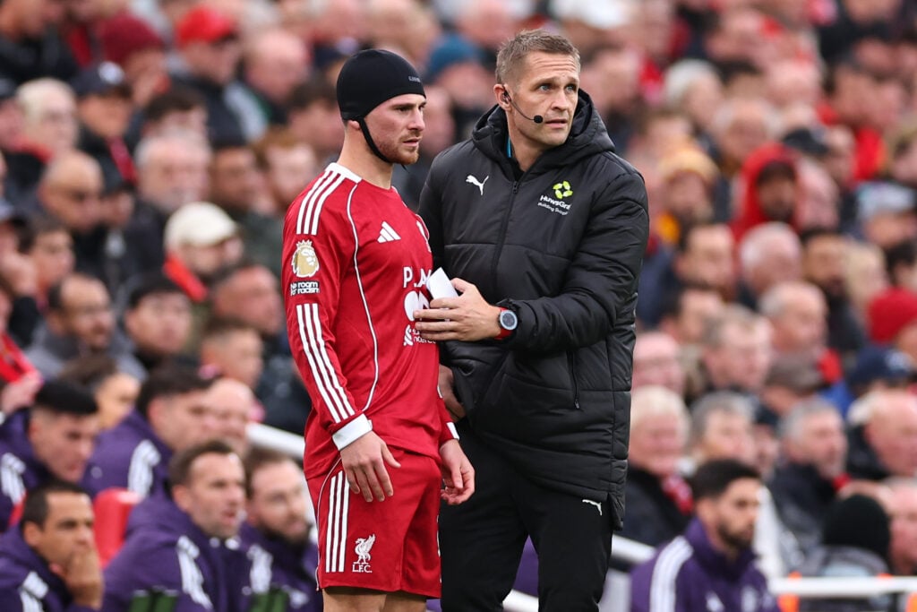 Alexis Mac Allister of Liverpool comes back on with a head bandage during the Premier League match between Liverpool and Manchester United