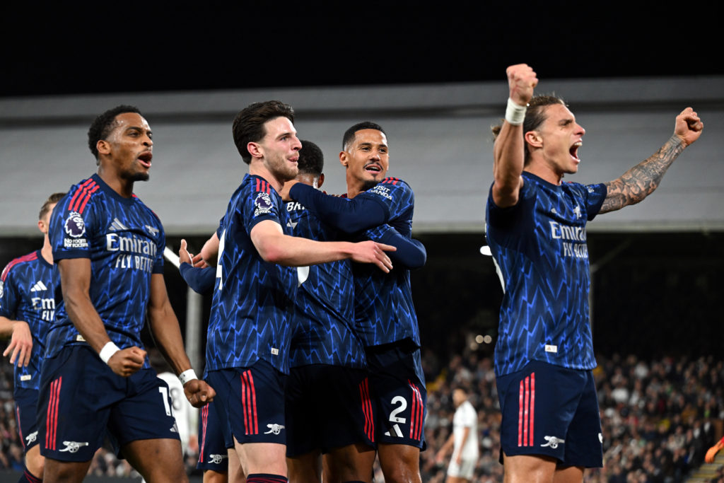 Arsenal players celebrate after scoring against Fulham in the Premier League