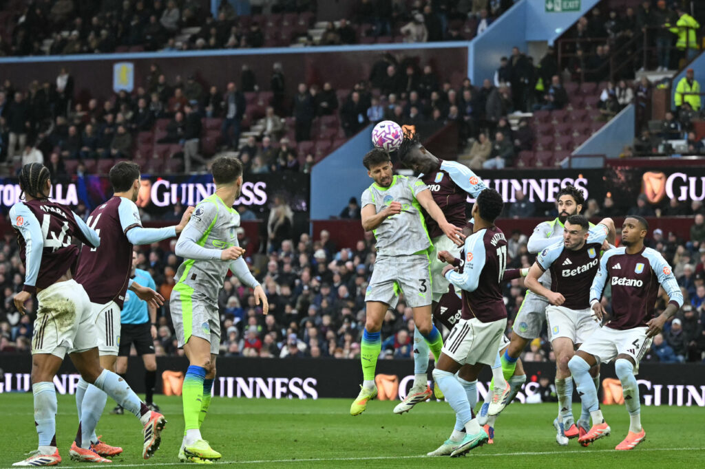 Aston Villa and Manchester City players challenge for the ball during a corner in the Premier League