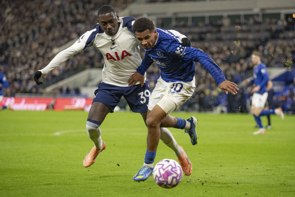 Iliman Ndiaye and Kolo Muani tussle for the ball during Everton v Tottenham Hotspur in the Premier League