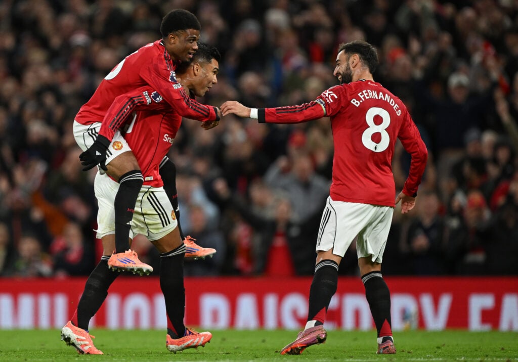 Casemiro of Manchester United celebrates scoring his team's second goal with teammates Amad Diallo and Bruno Fernandes during the Premier League match between Manchester United and Brighton