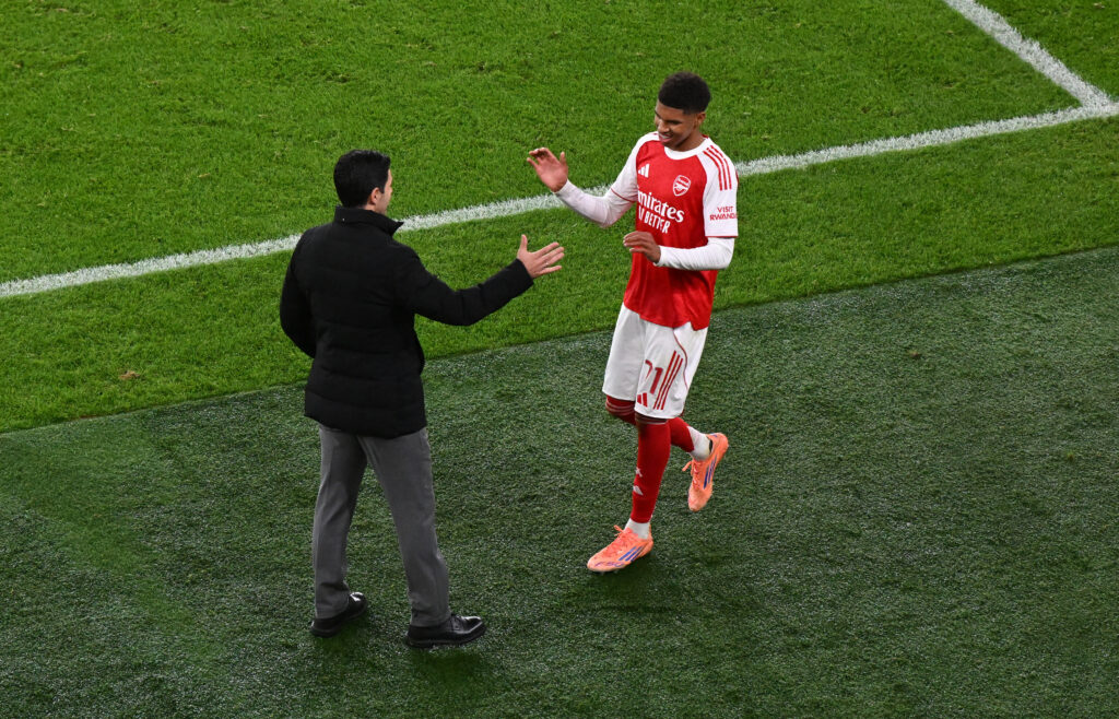 Mikel Arteta embraces Andre Harriman-Annous during Arsenal vs Brighton