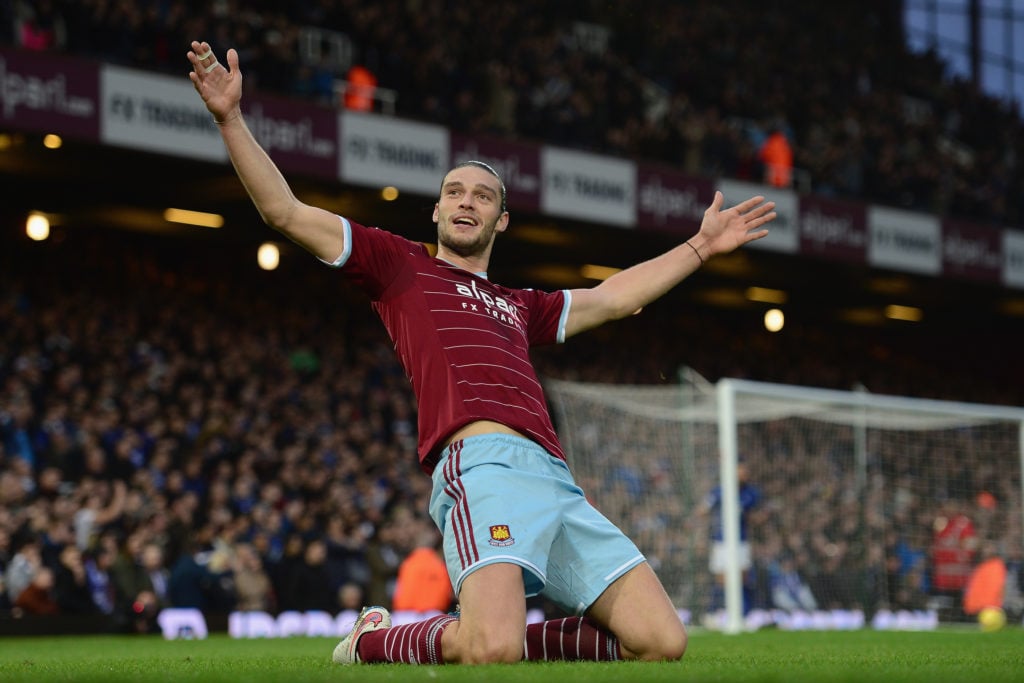 West Ham striker Andy Carroll knee slides to celebrate scoring a goal against Leicester City at Upton Park