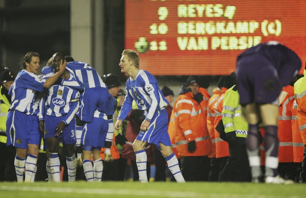 Wigan Athletic celebrate scoring vs Arsenal in the Premier League at Highbury