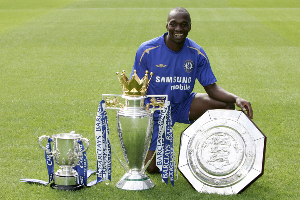 Claude Makelele poses alongside his trophies at Chelsea.