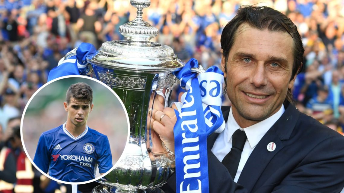 Antonio Conte of Chelsea celebrates winning the FA Cup, with midfielder Oscar starring left