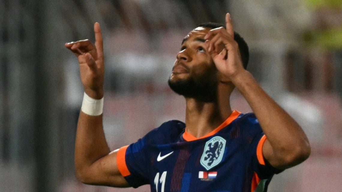 Netherlands' forward #11 Cody Gakpo looks to the sky as he celebrates after succesfully converting a penalty to score the Netherlands's first goal ...