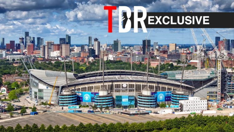 Aerial view of Manchester City's Etihad Stadium, TBR logo and exclusive label inset