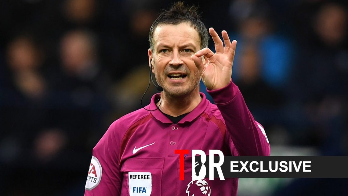 Mark Clattenburg looks on