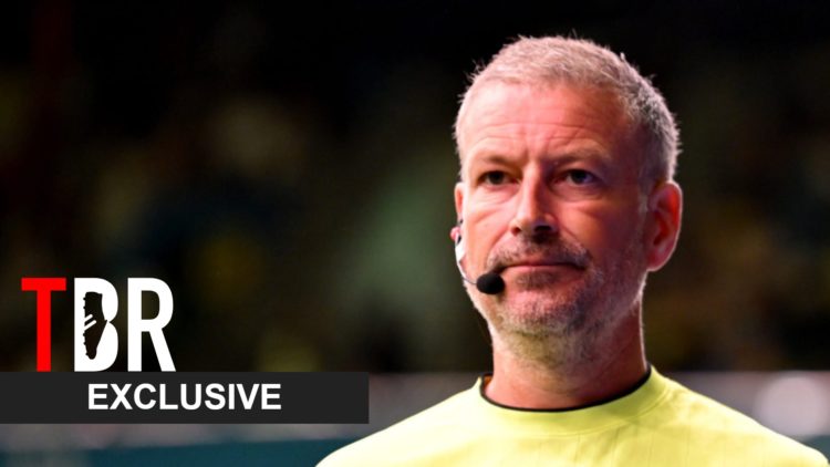 Mark Clattenburg looks on during a Baller League match alongside an exclusive TBR Football banner