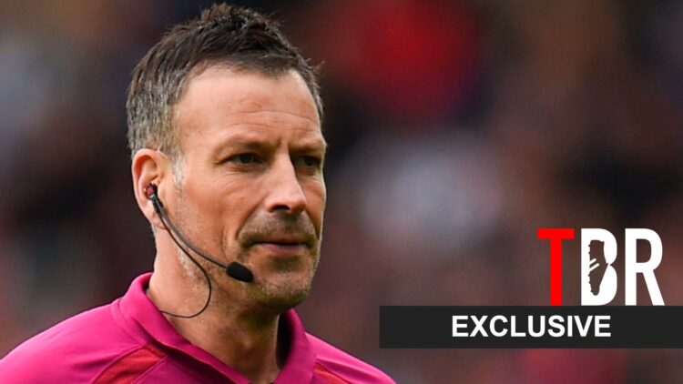 Mark Clattenburg reacts during a Premier League match alongside an exclusive TBR football banner