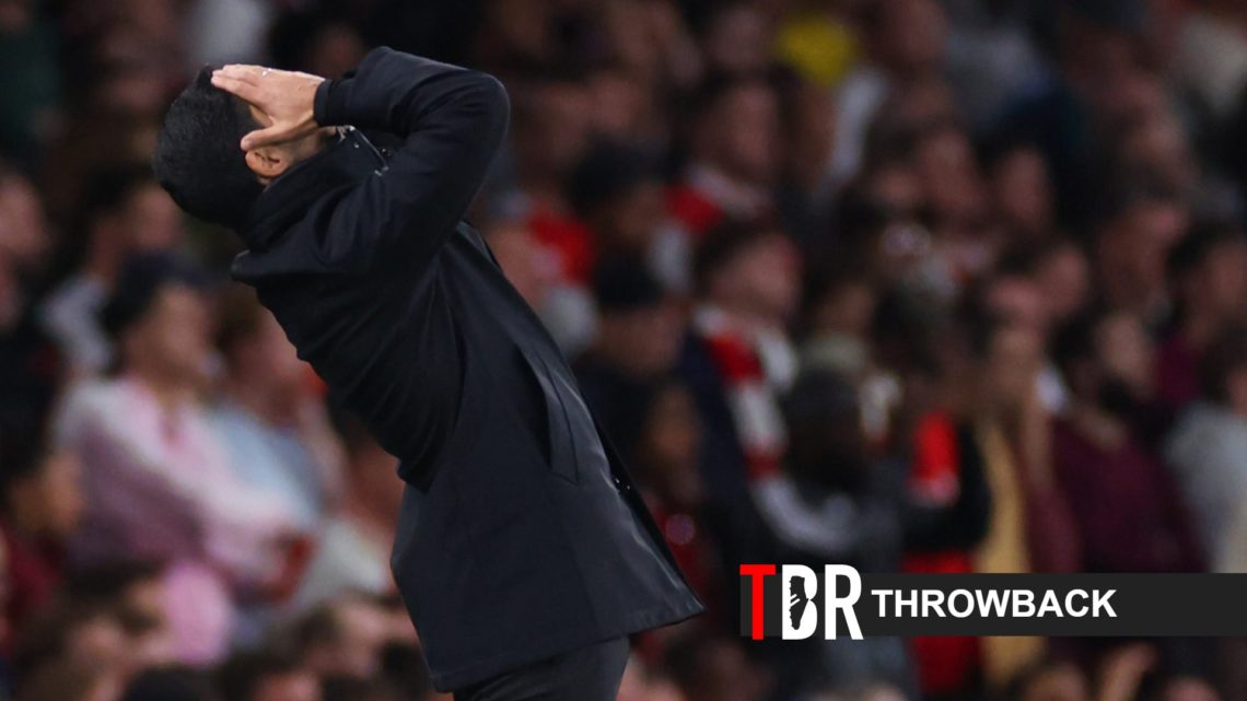 Mikel Arteta reacts during an Arsenal match alongside a throwback banner