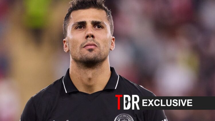 Rodri of Manchester City looks on