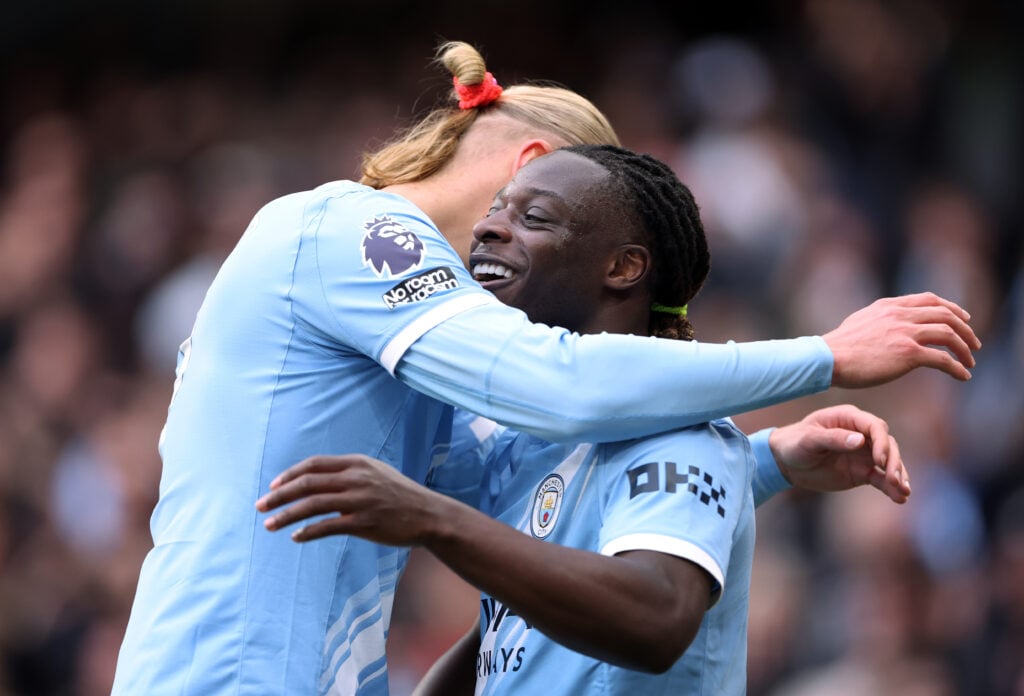 Jeremy Doku and Erling Haaland during Manchester City v Brentford - Premier League
